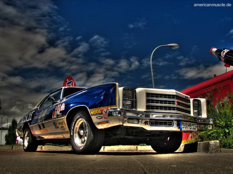Blue classic muscle car with decals
