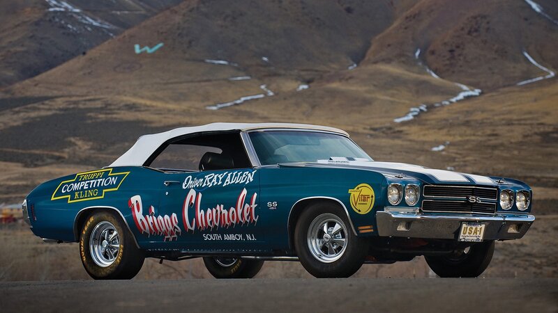 Blue classic race car on road