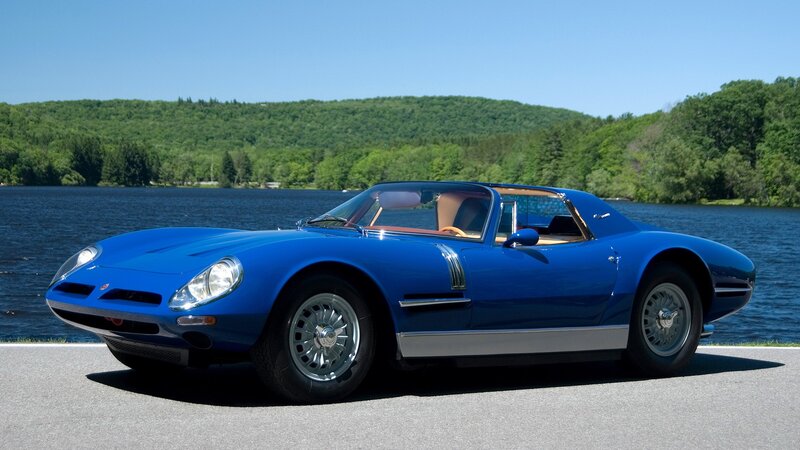 Blue classic sports car by lake