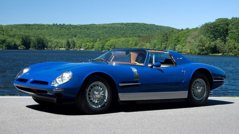 Blue classic sports car by lake