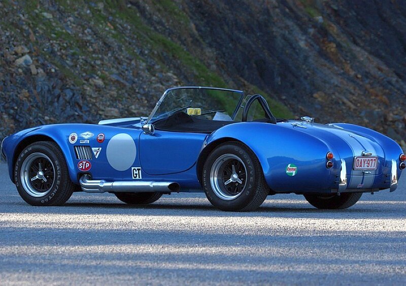Blue classic sports car on road