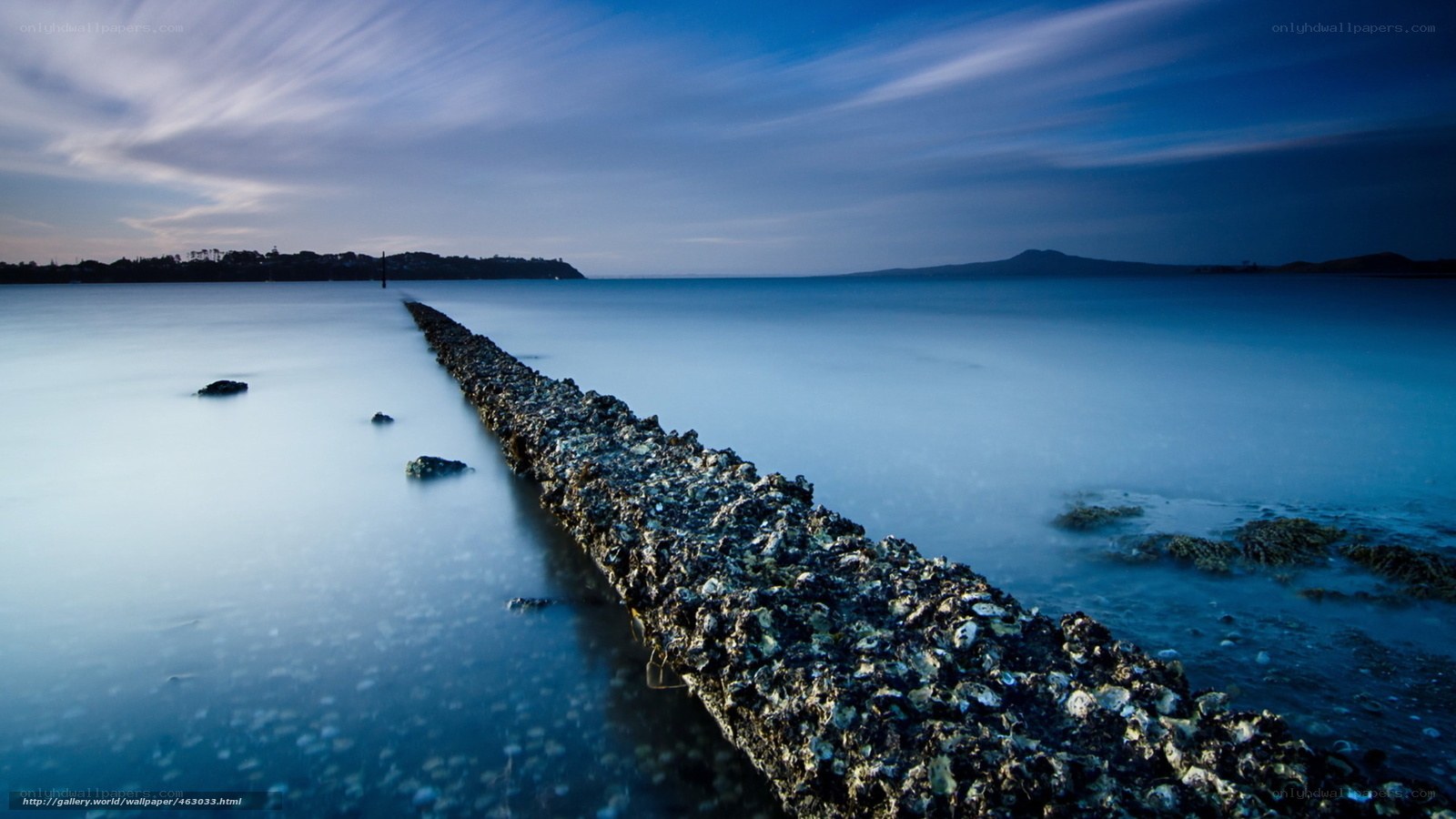 Blue coastal pier at dusk