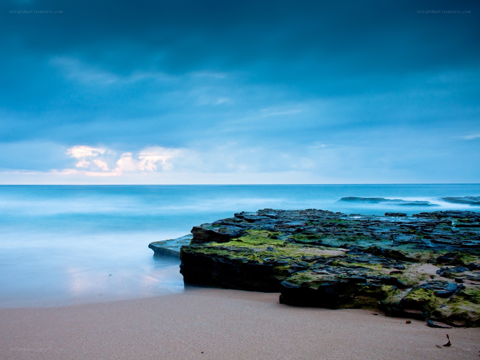 Blue coastal rocks at dawn