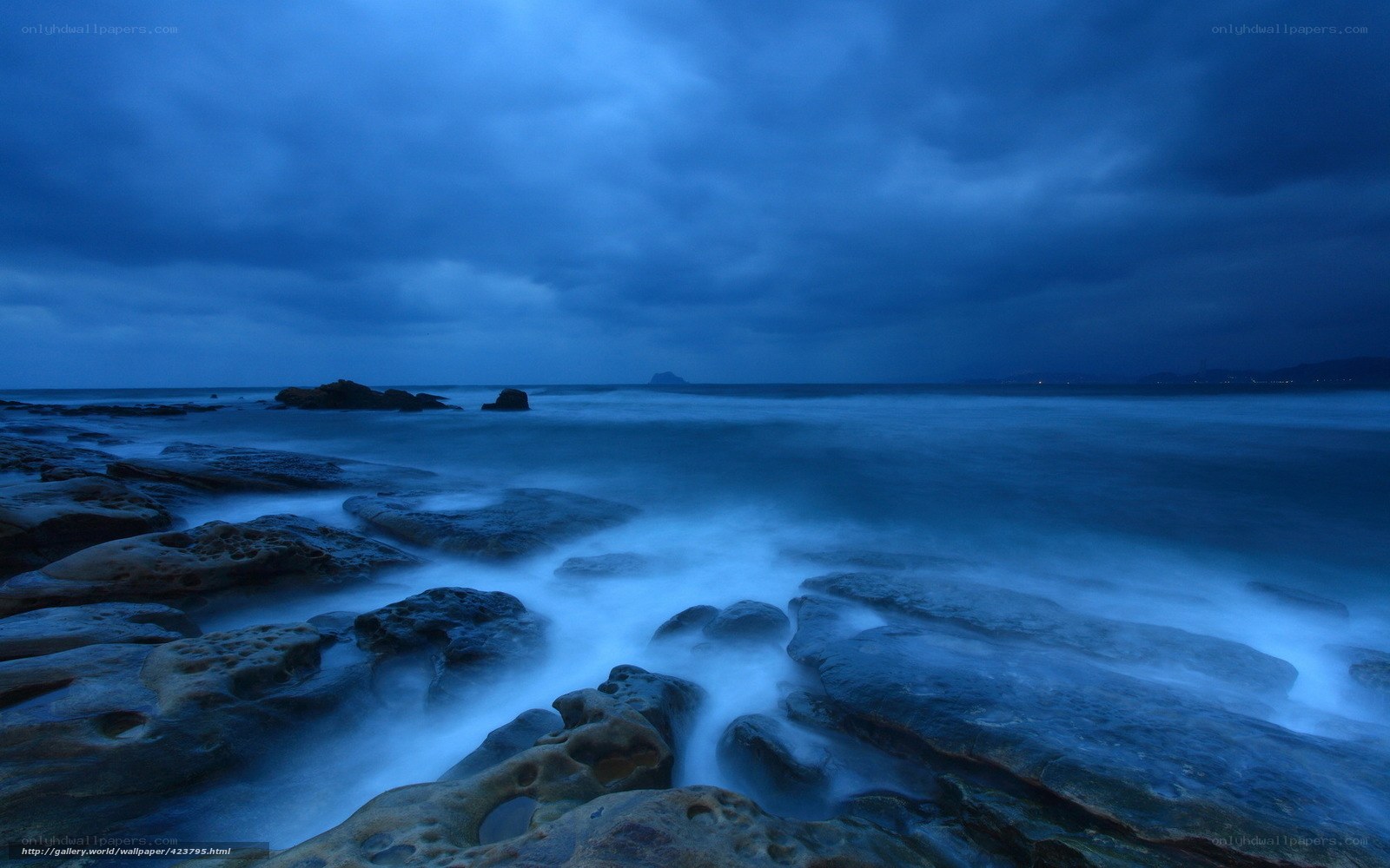 Blue coastal rocks at dusk