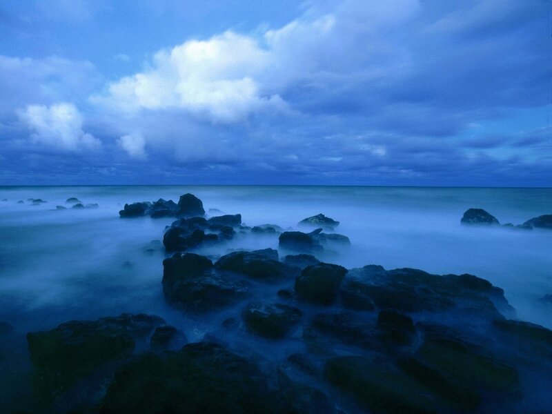 Blue coastal rocks at dusk