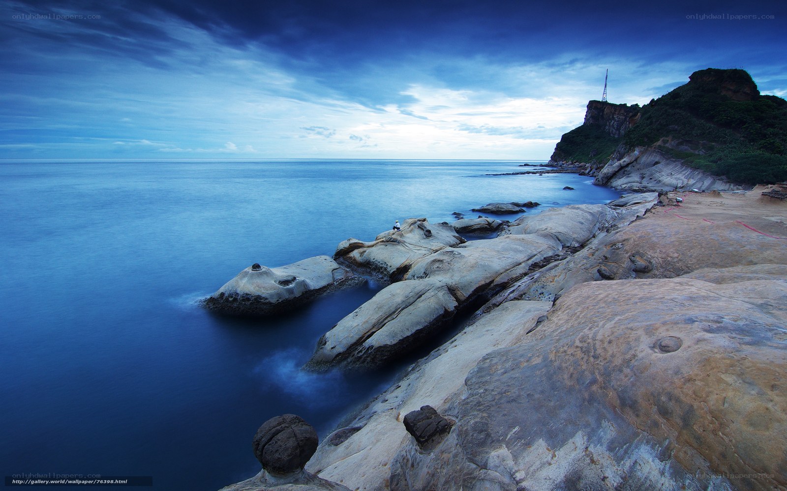 Blue coastal rocks at dusk