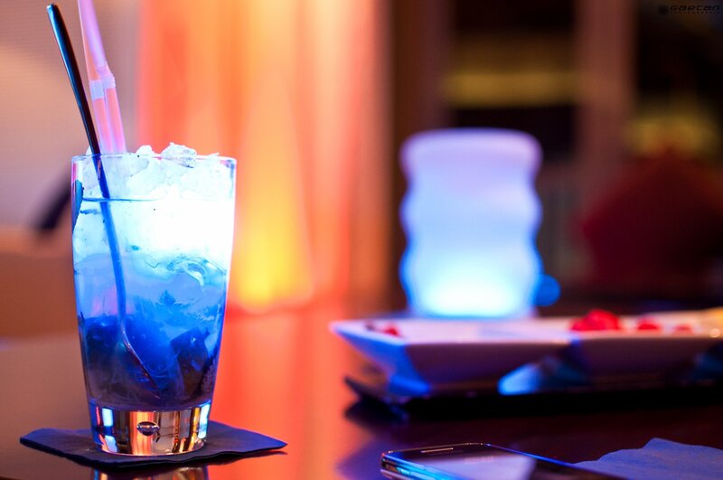 blue cocktail with straws