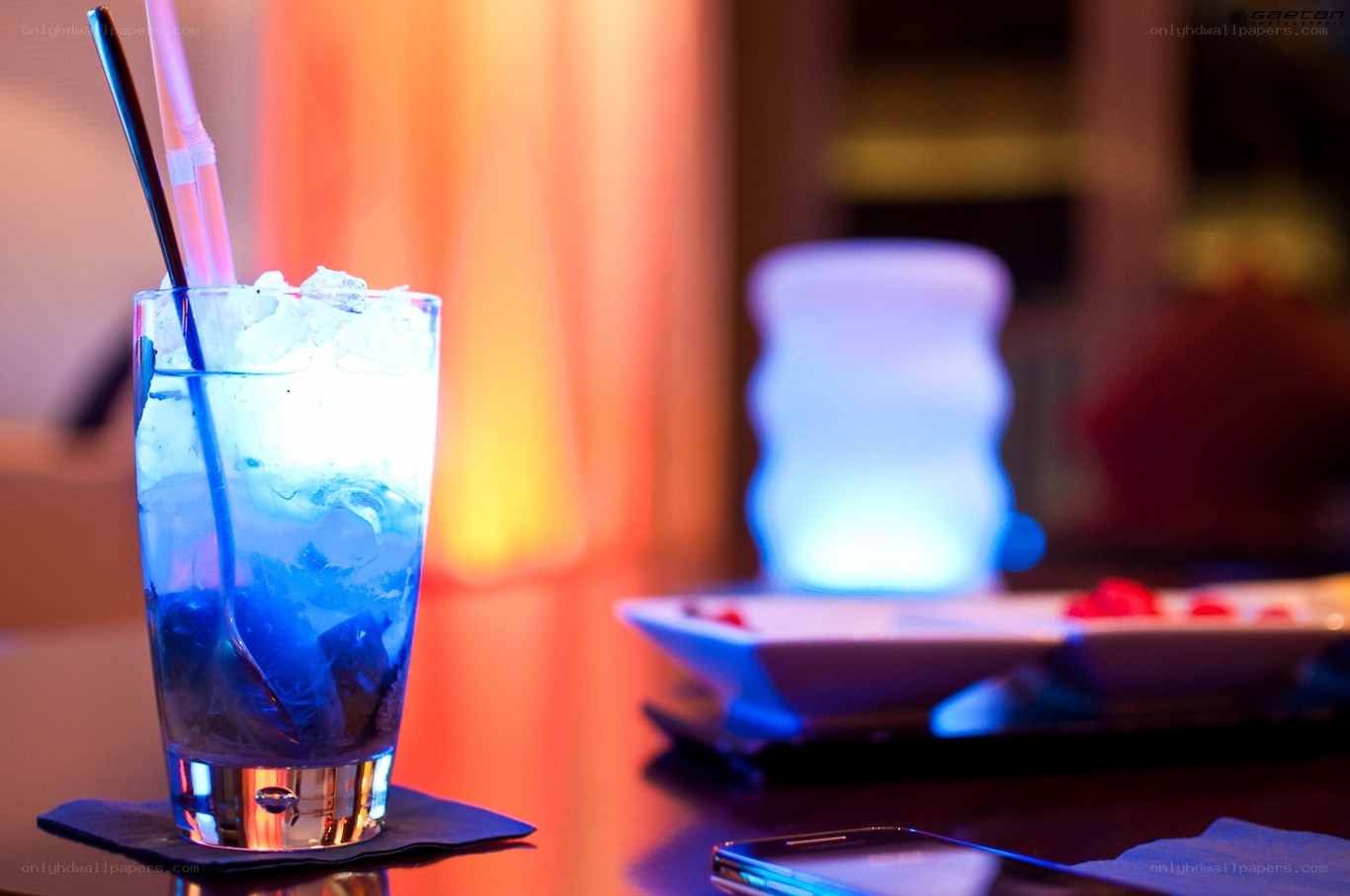 blue cocktail with straws