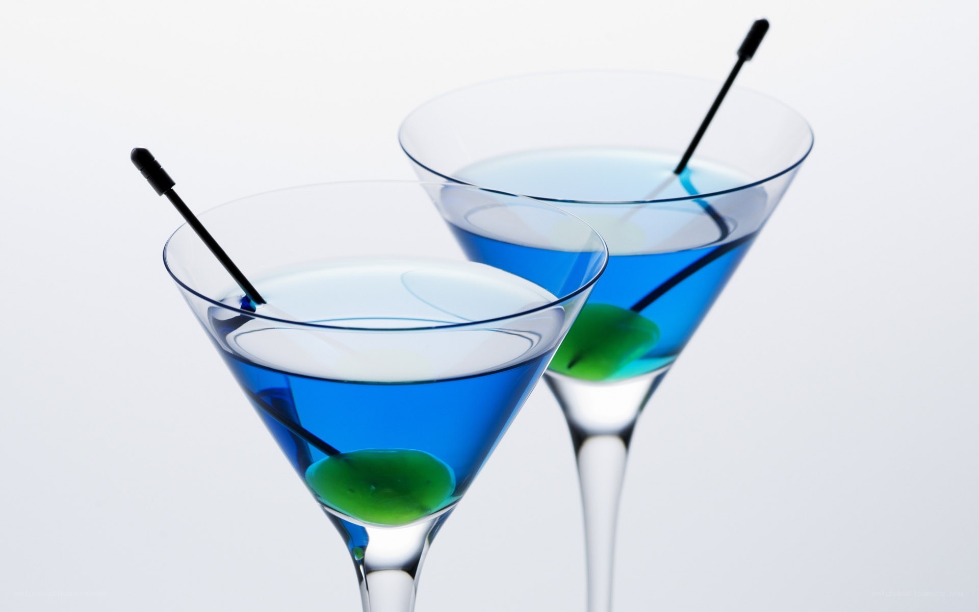Blue cocktails with olives