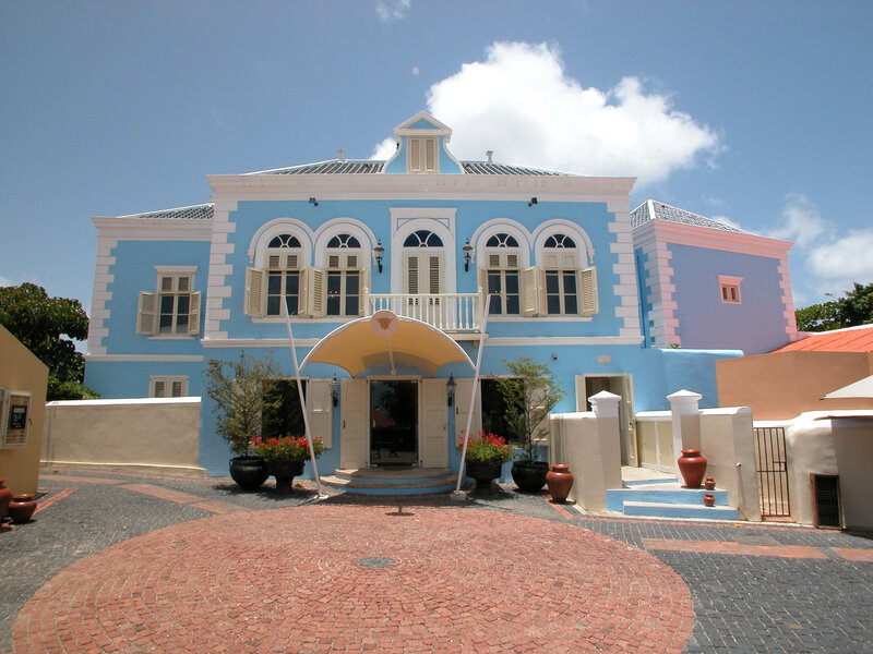 blue colonial building with courtyard