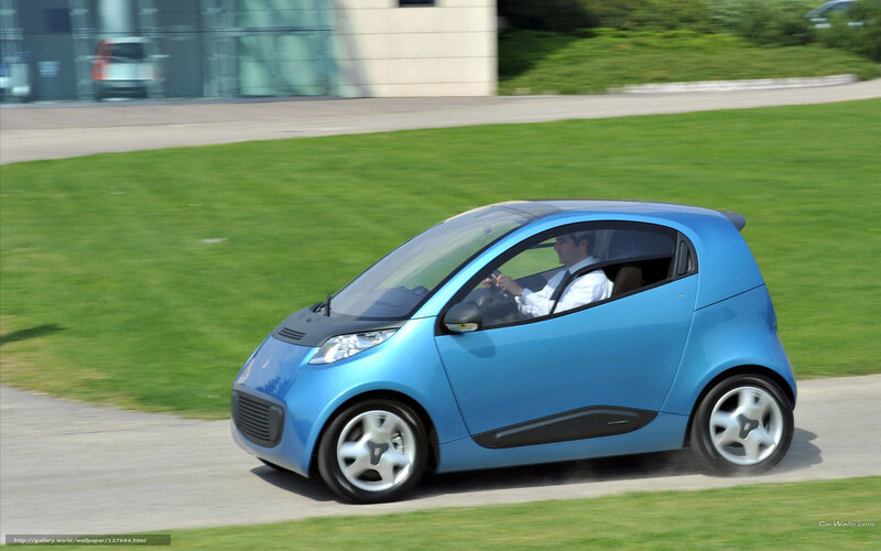 blue compact car driving