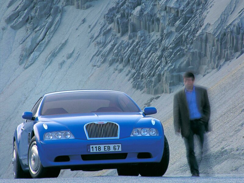Blue Concept Car — Dramatic, Photograph, Man, Rocky Cliff