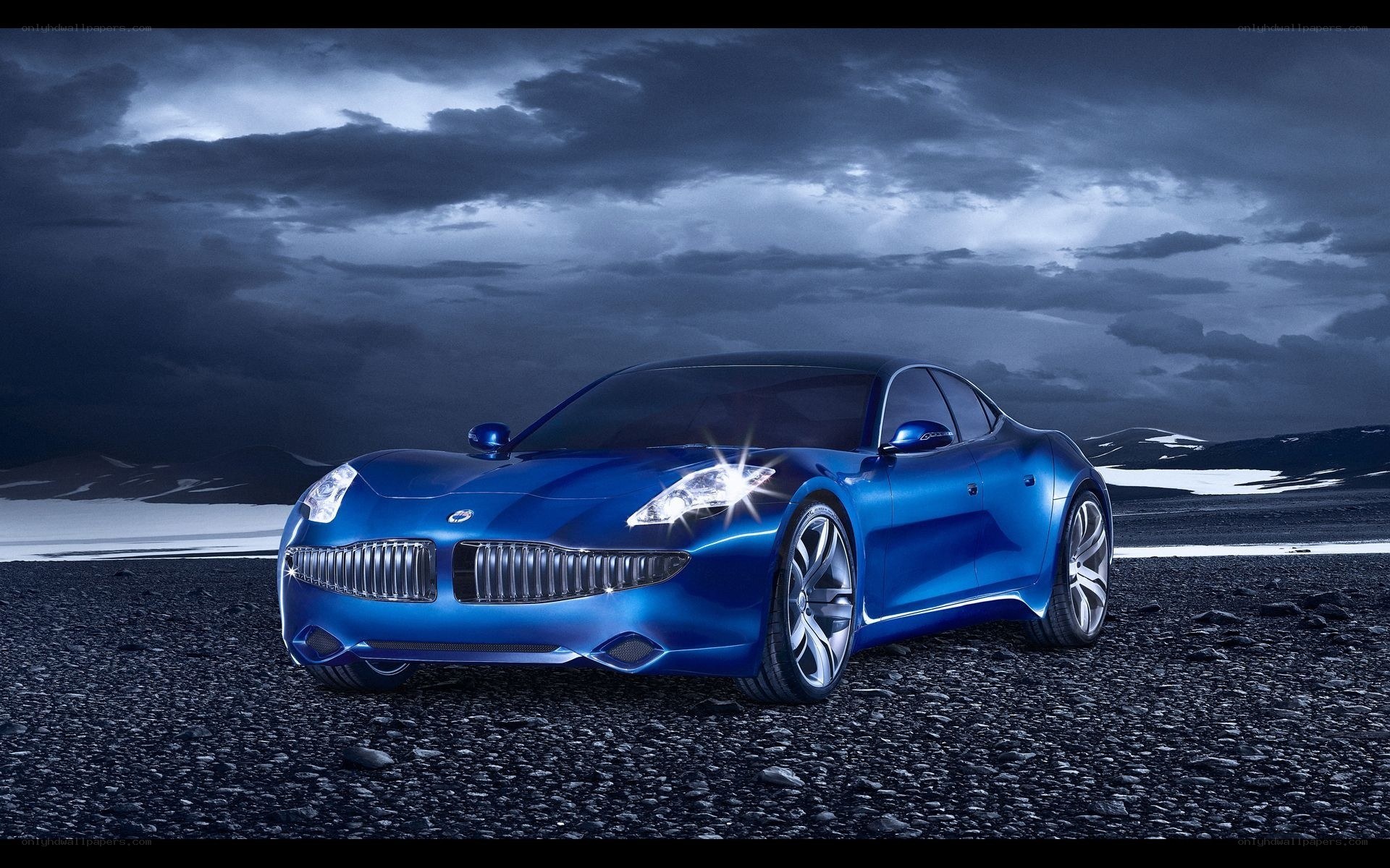Blue concept car on rocky terrain