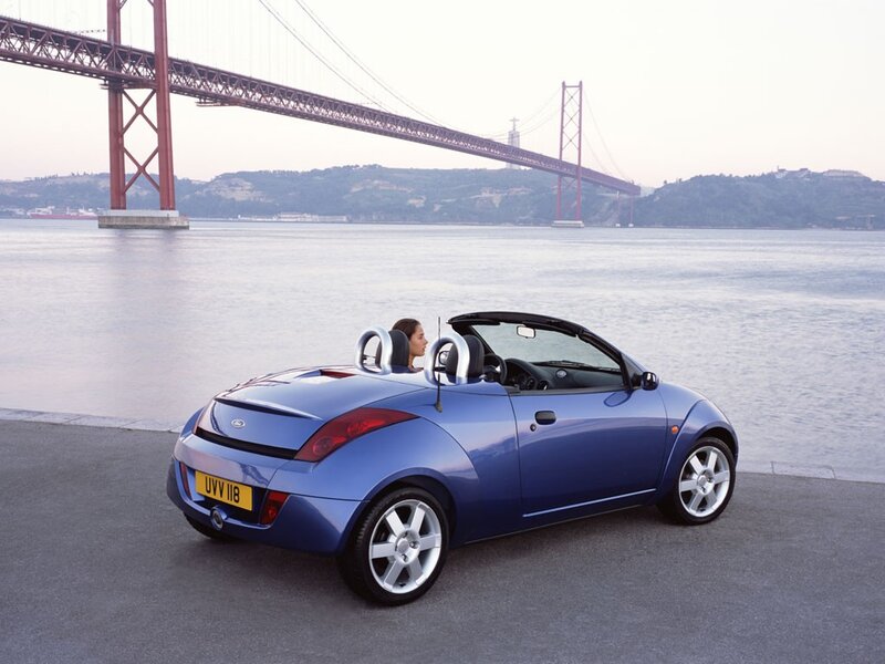 Blue convertible by the river