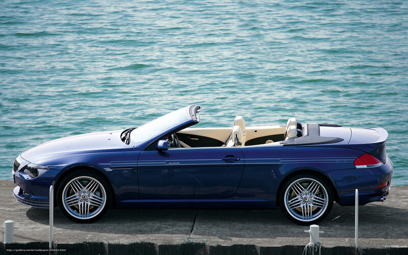 Blue convertible by the water