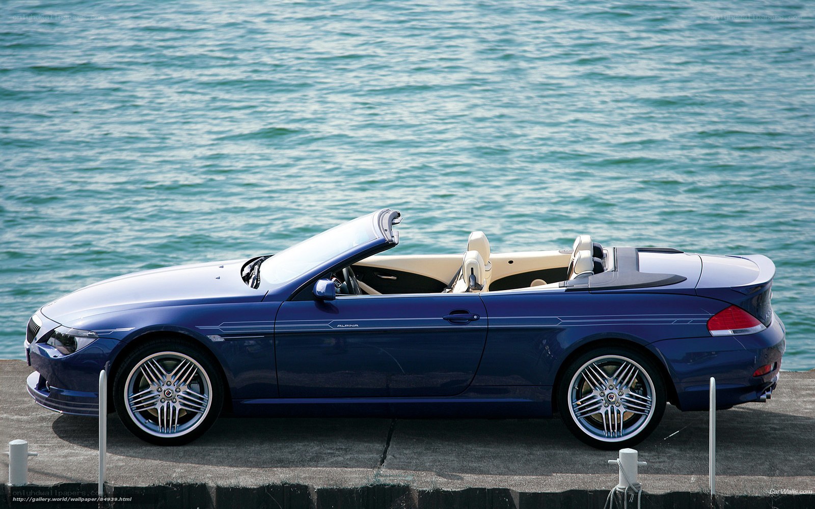 Blue convertible by the water
