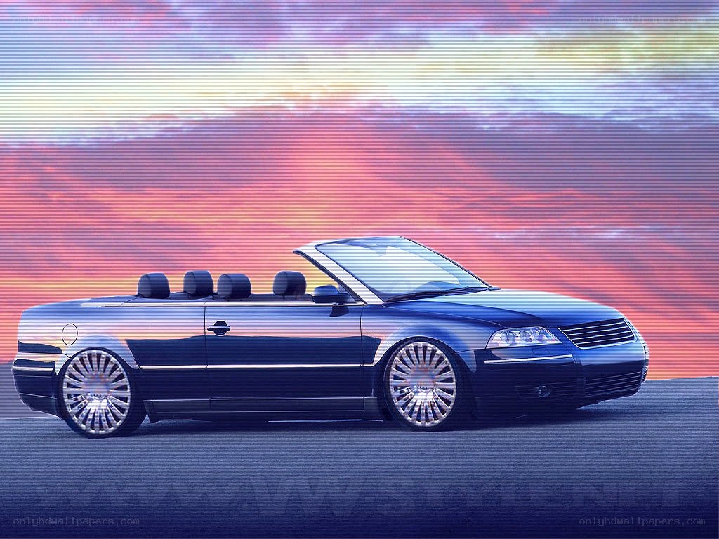 blue convertible car at sunset