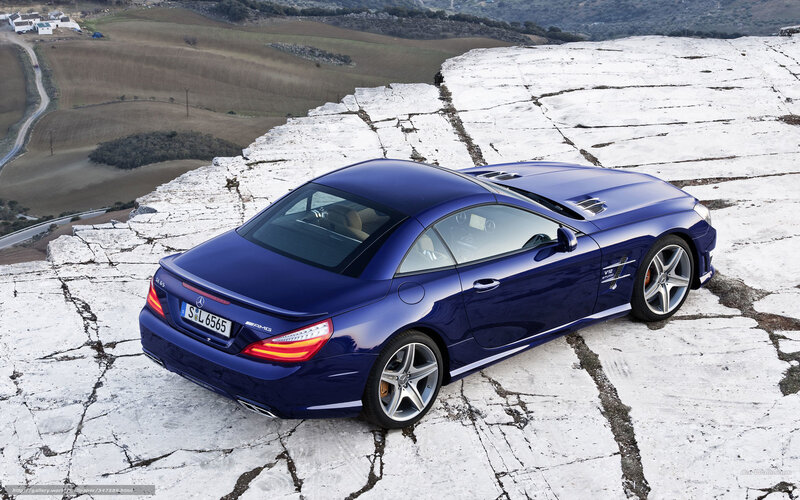 Blue Convertible Car — Dramatic, Afternoon, Photograph, Rocky Cliff