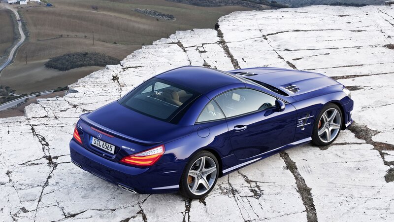 Blue Convertible Car — Dramatic, Photograph, Rocky Surface