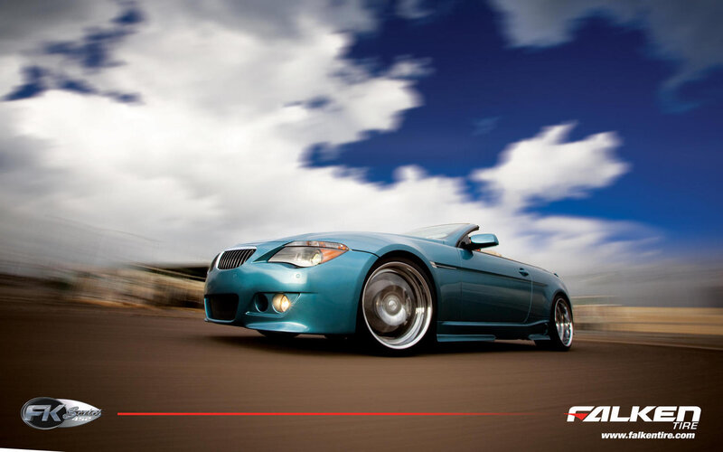 Blue convertible car in motion