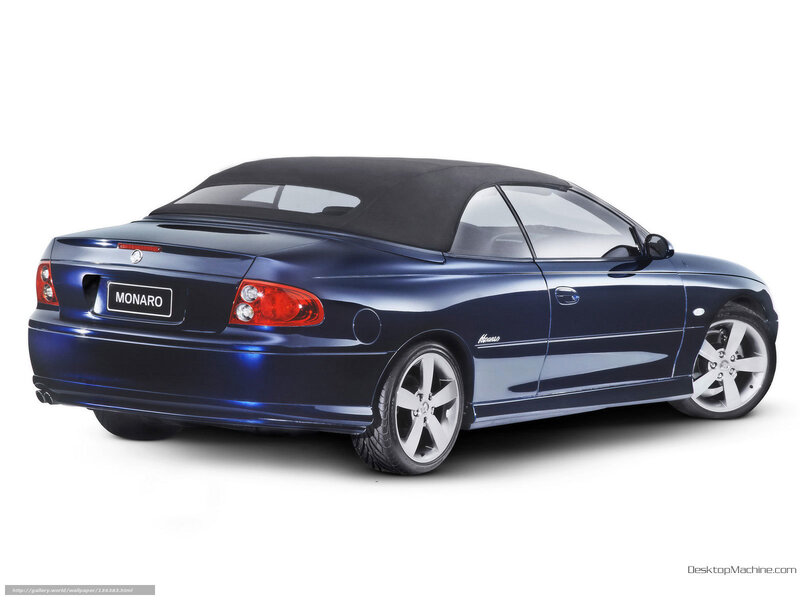 Blue Convertible Car — Neutral, Photograph, Black Soft Top, Silver Wheels, Rear Lights