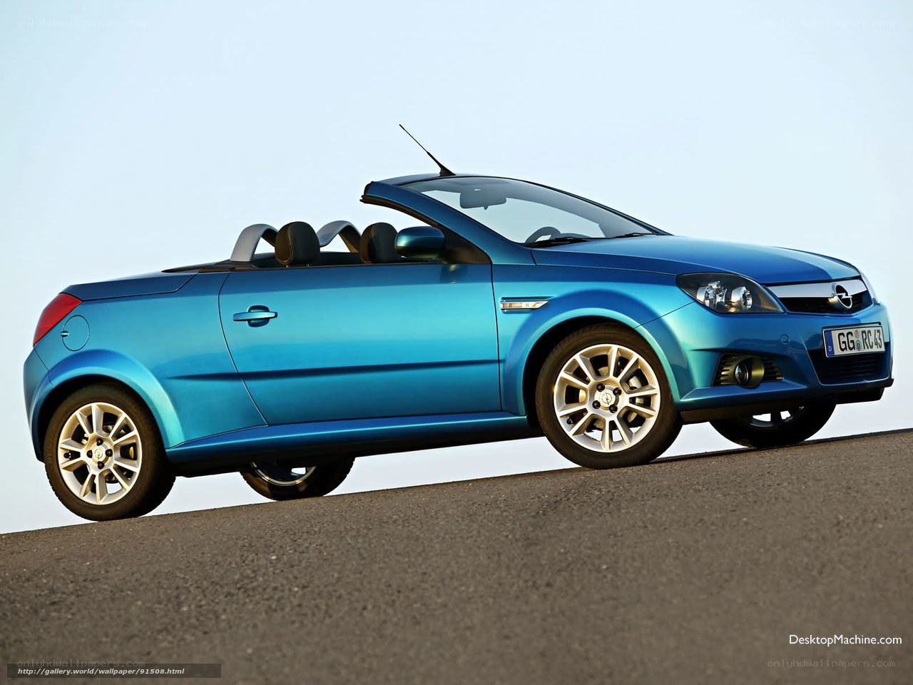 blue convertible car on road