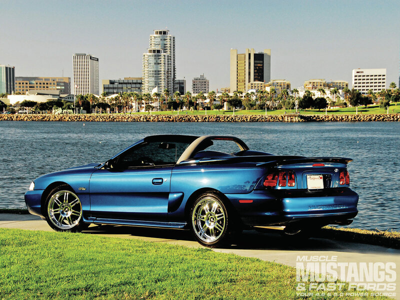 Blue Convertible Car — Serene, Afternoon, Photograph, City Skyline