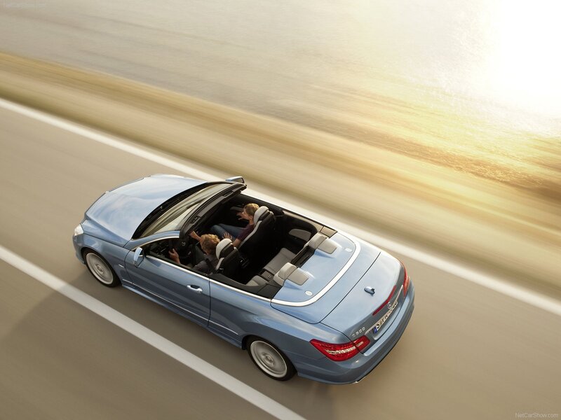 Blue convertible driving on road