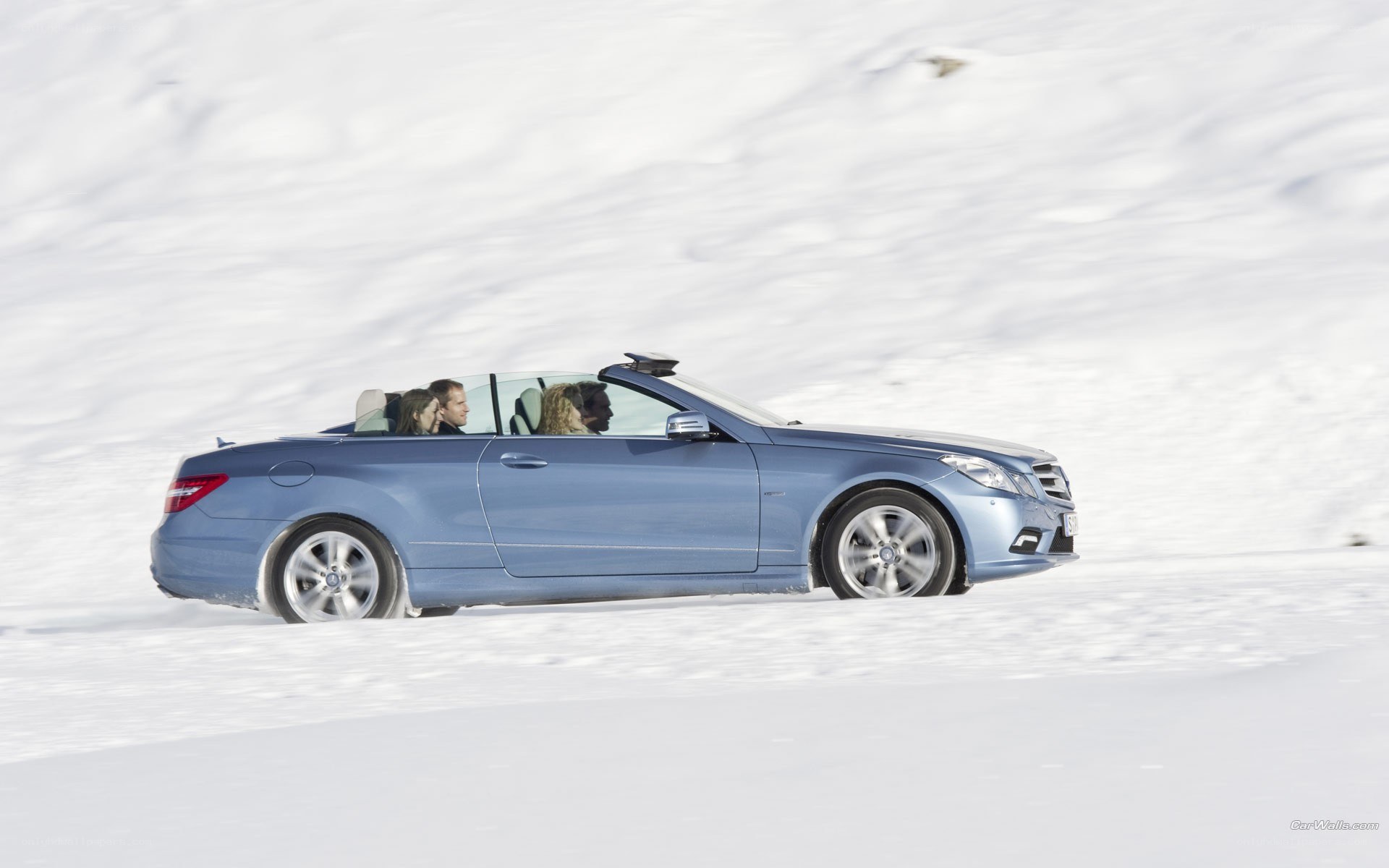 Blue convertible in snow