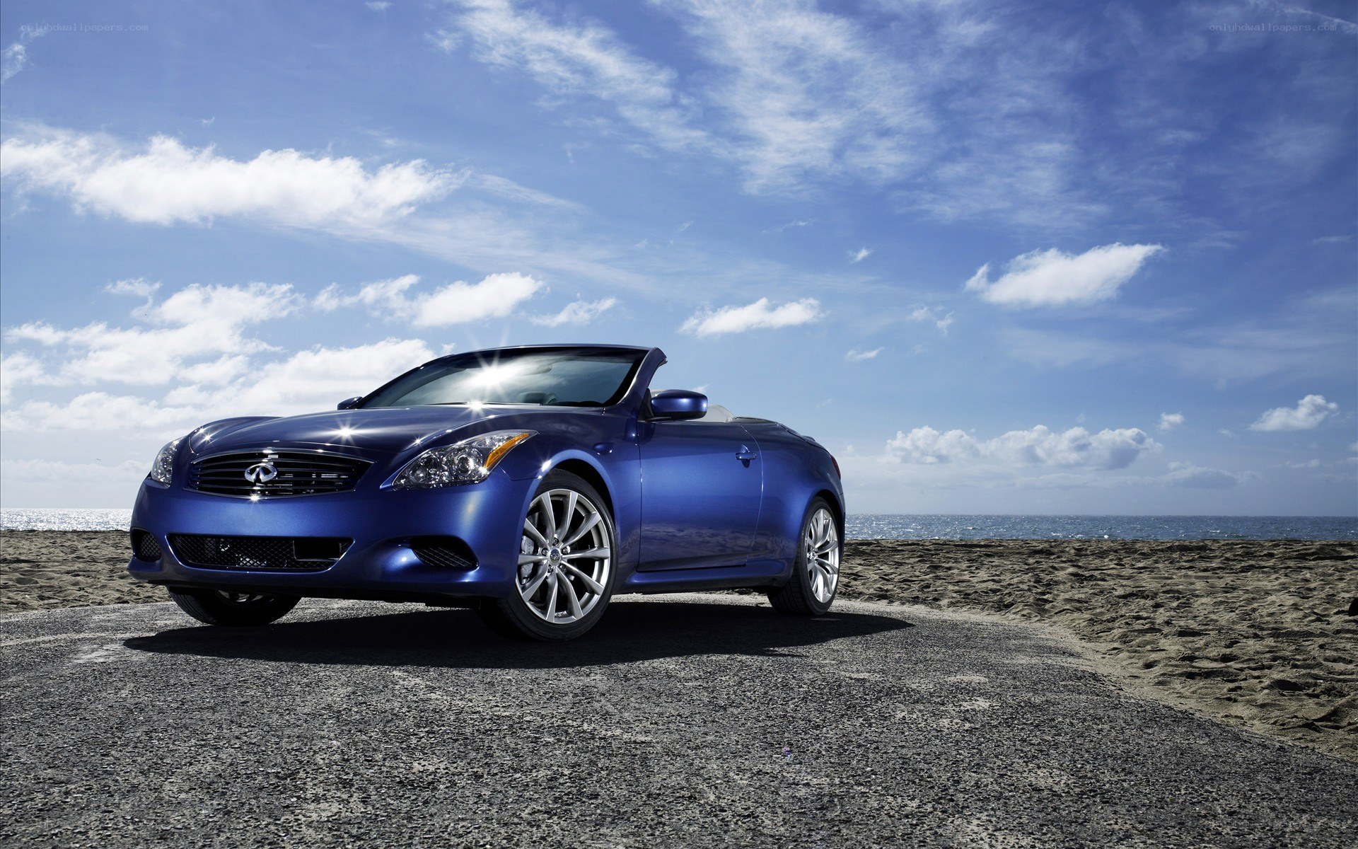 Blue convertible on beach