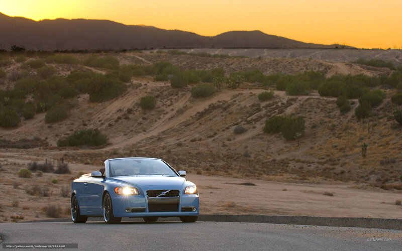 Blue convertible on desert road