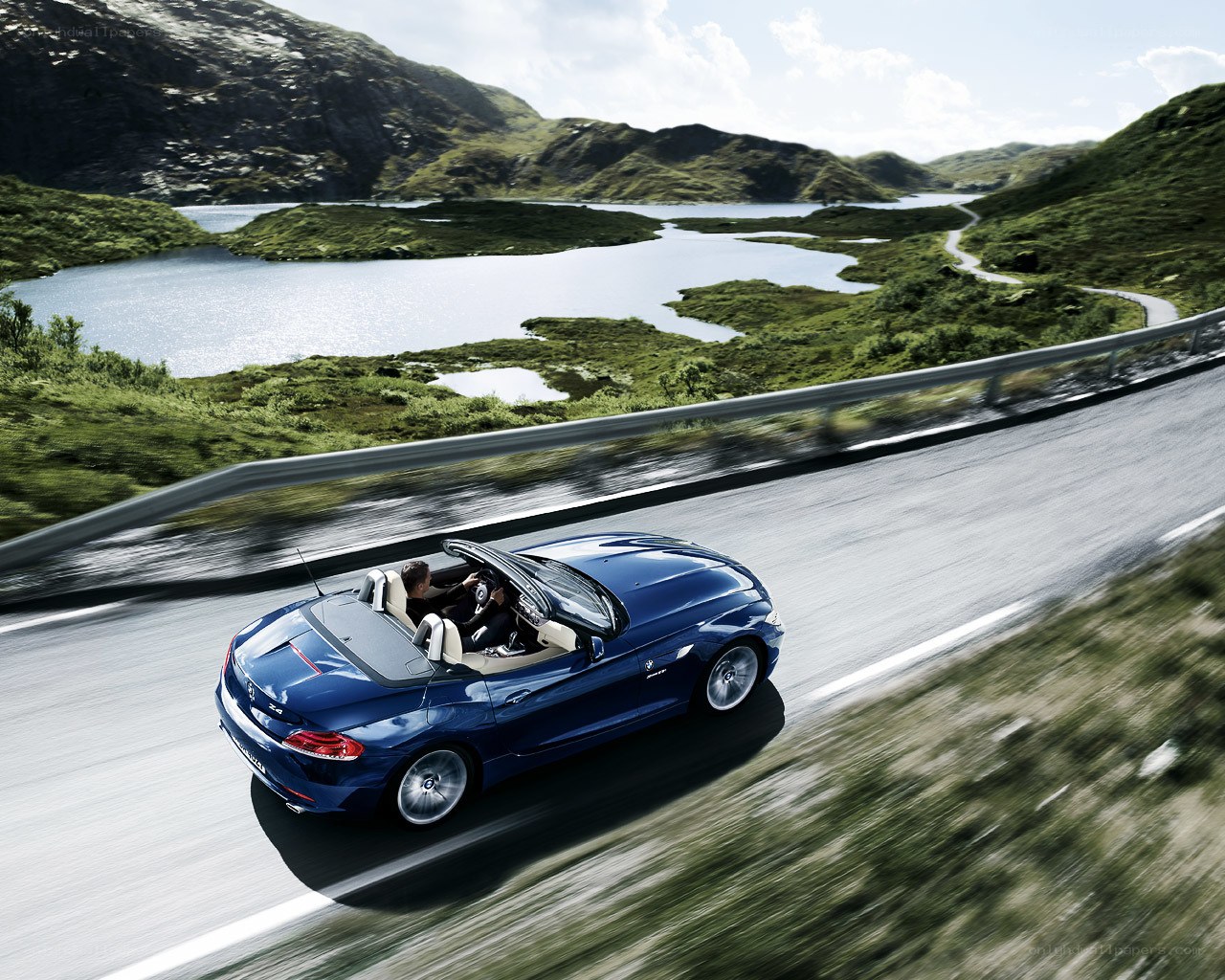 Blue convertible on scenic road