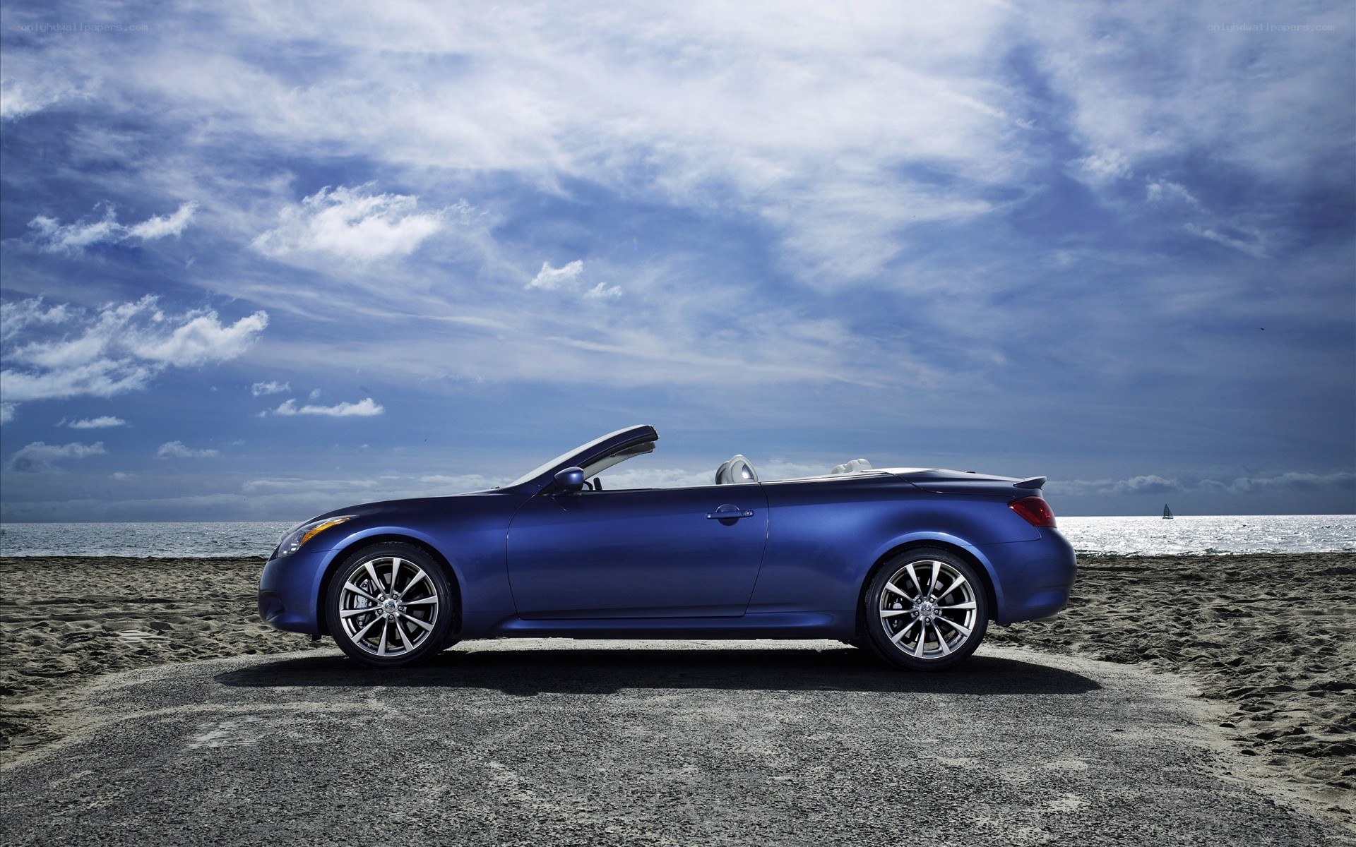 Blue convertible on the beach