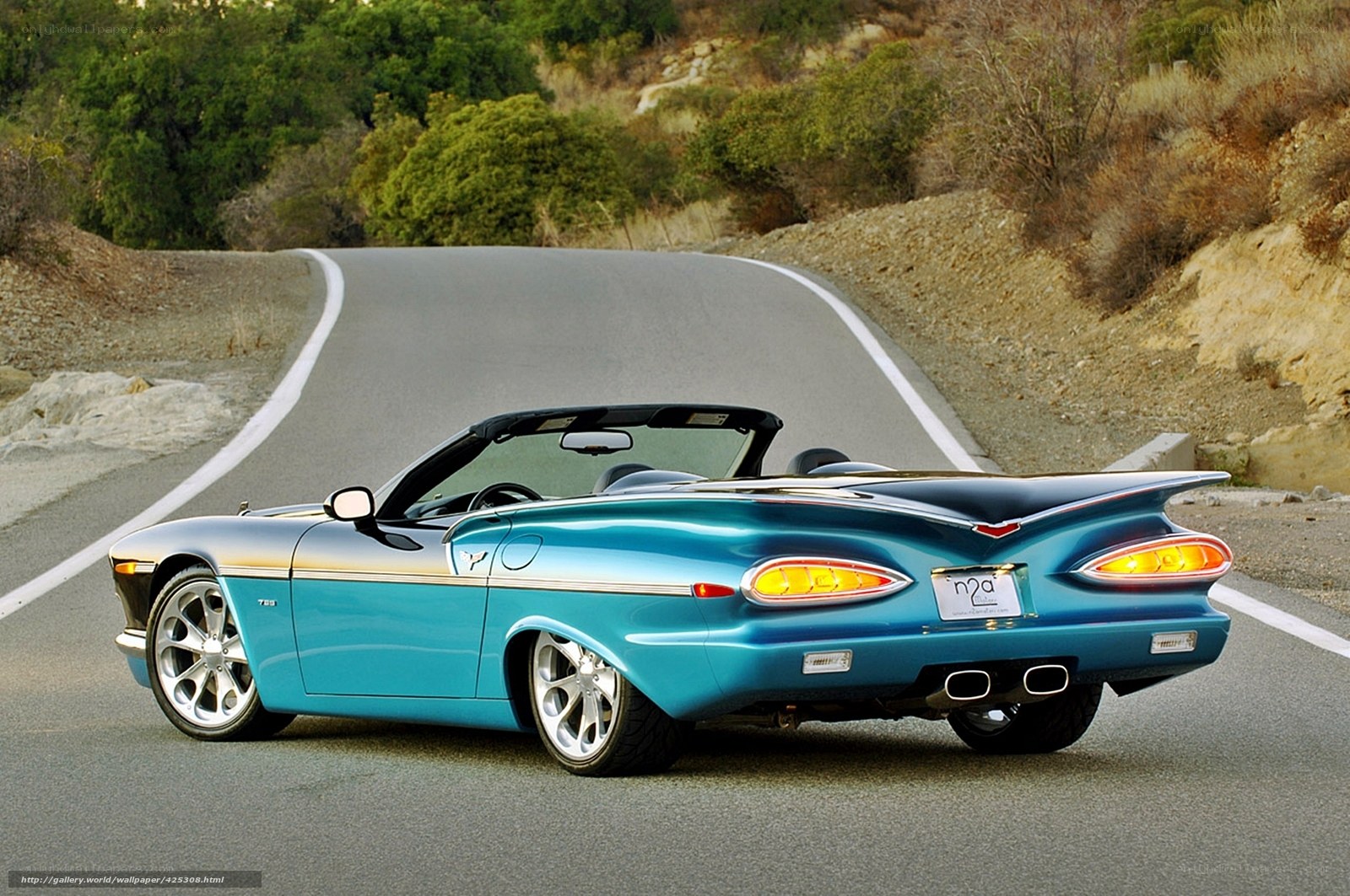Blue convertible on winding road