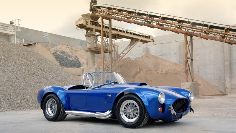 Blue Convertible Sports Car — Dramatic, Afternoon, Photograph, Gravel Piles