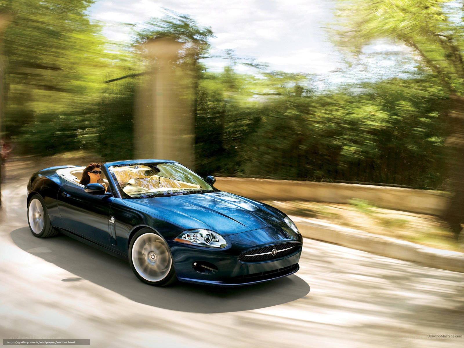 Blue convertible sports car in motion