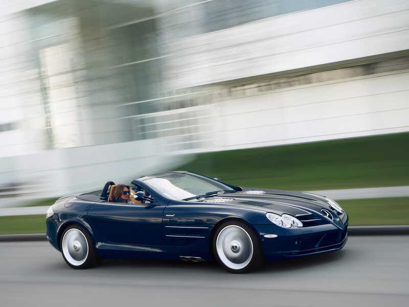 Blue convertible sports car in motion