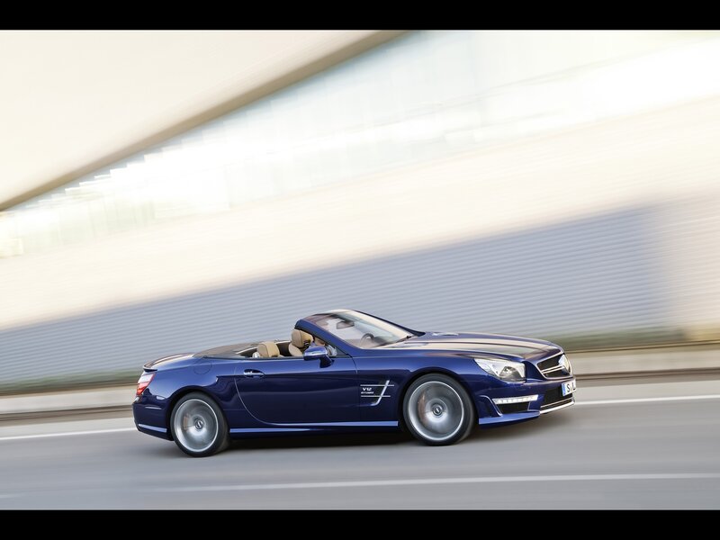 Blue convertible sports car in motion