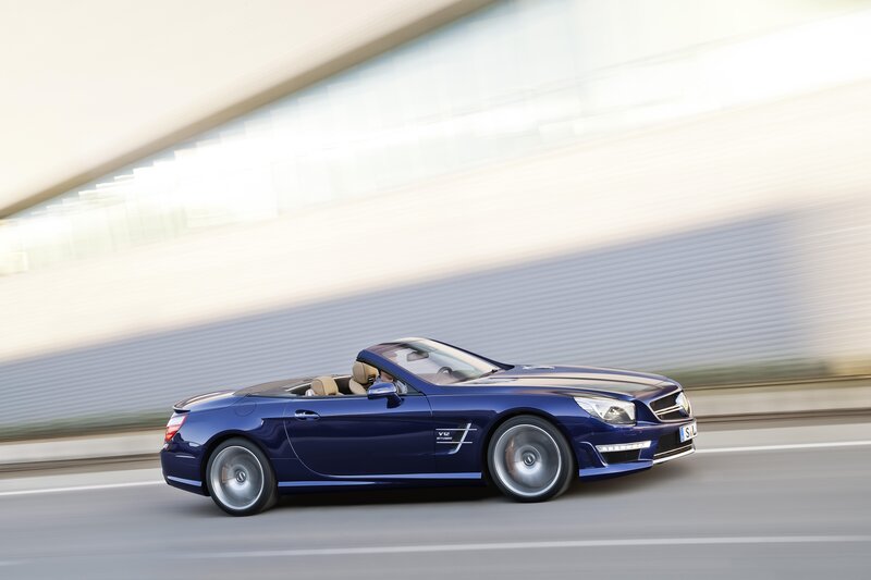 Blue convertible sports car in motion