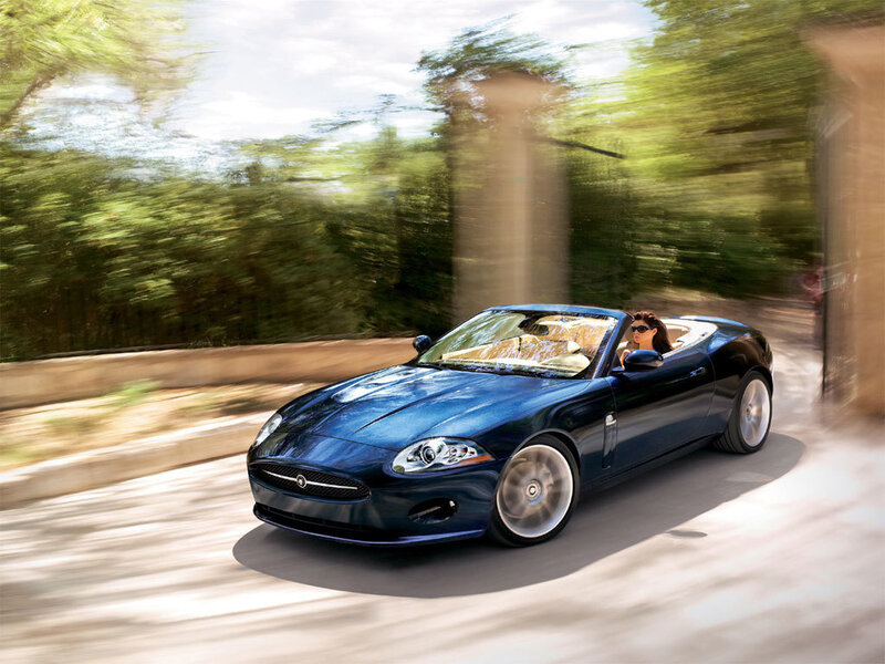 Blue convertible sports car in motion