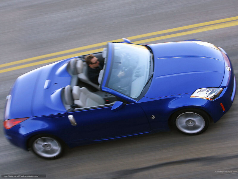 blue convertible sports car in motion