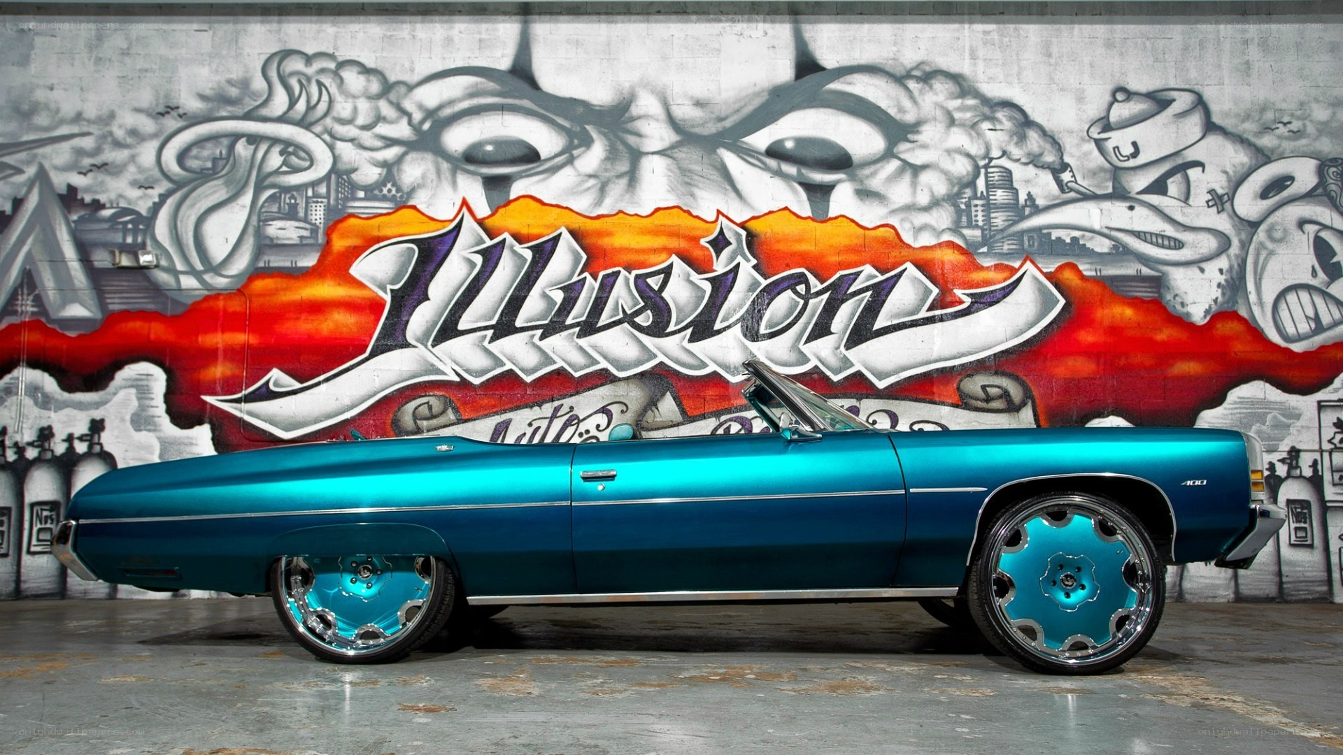 Blue convertible with graffiti art