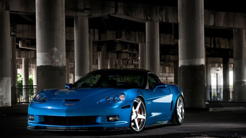 Blue Corvette Car — Dramatic, Night, Photograph, Concrete Pillars