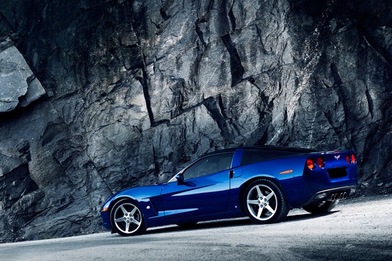 Blue Corvette Car — Dramatic, Photograph, Rock Wall