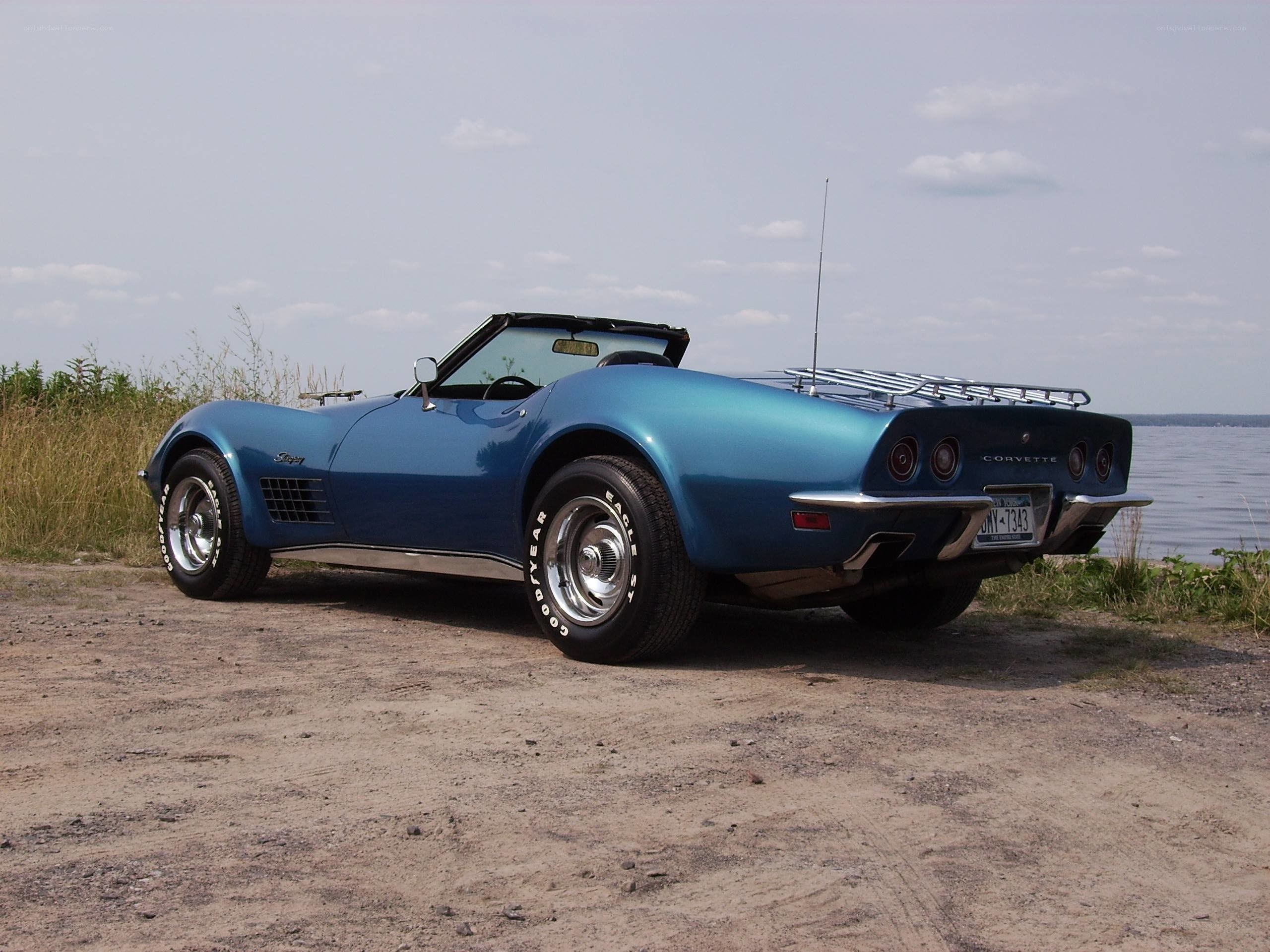 Blue Corvette convertible by water