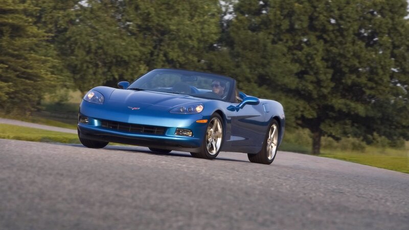 blue corvette convertible driving
