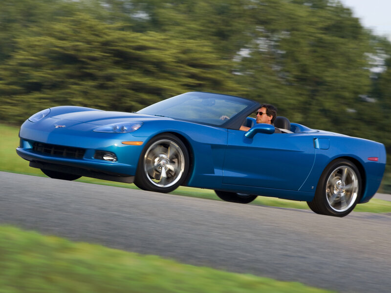 Blue Corvette convertible in motion