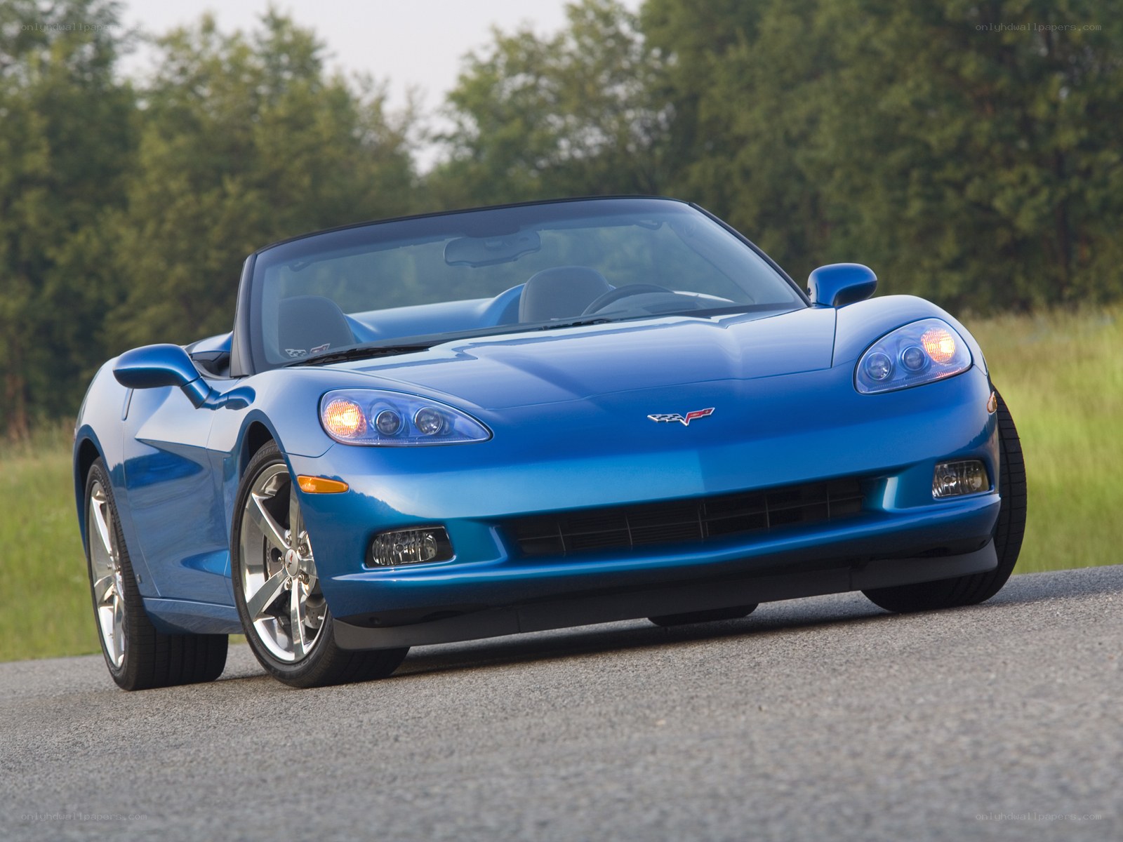 Blue Corvette convertible on road