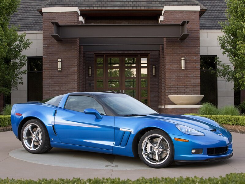 Blue Corvette in front of house