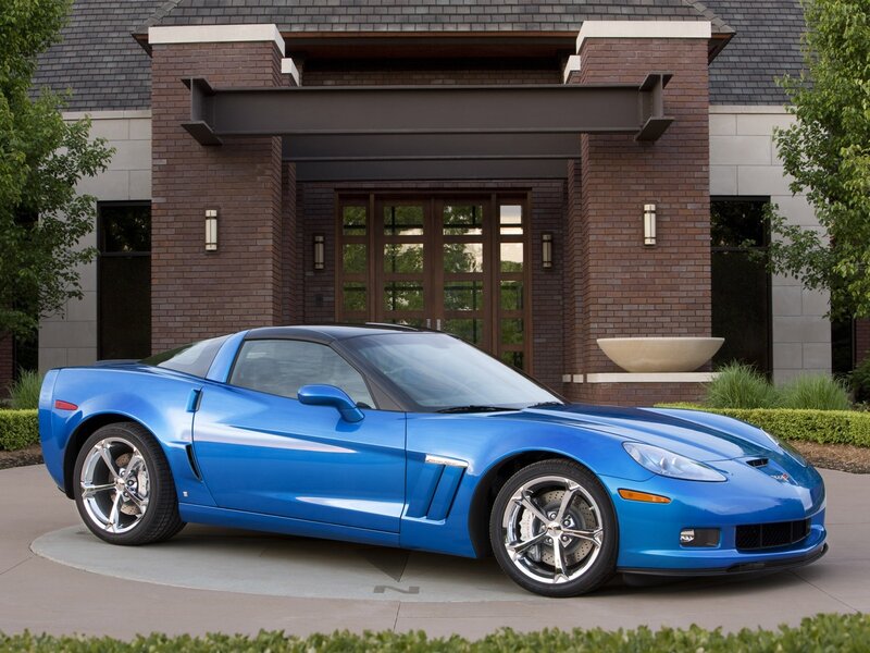 Blue Corvette in front of house